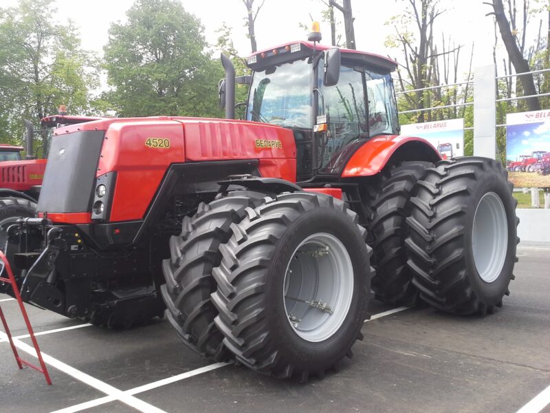 Greek farmers working on modern agricultural investment projects with tractors and irrigation systems