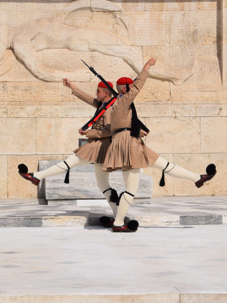 Greek military parade Athens March 25 soldiers marching Greek flags