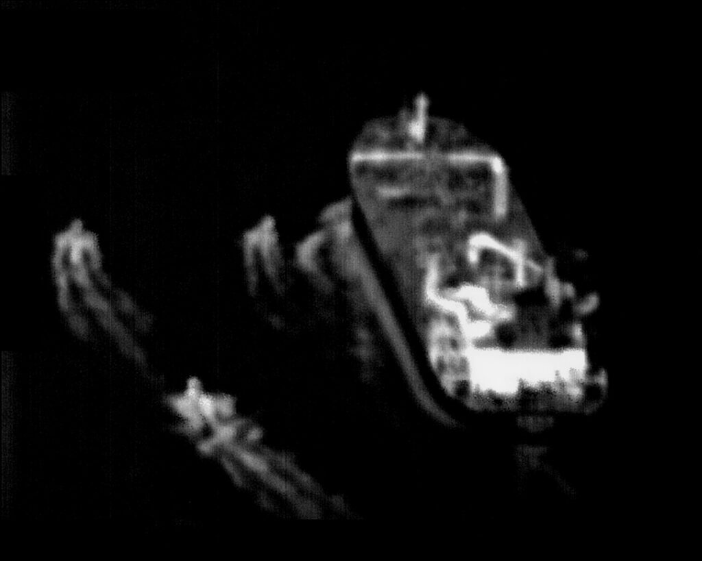 Oil tanker in Strait of Hormuz with military boats amid rising tensions