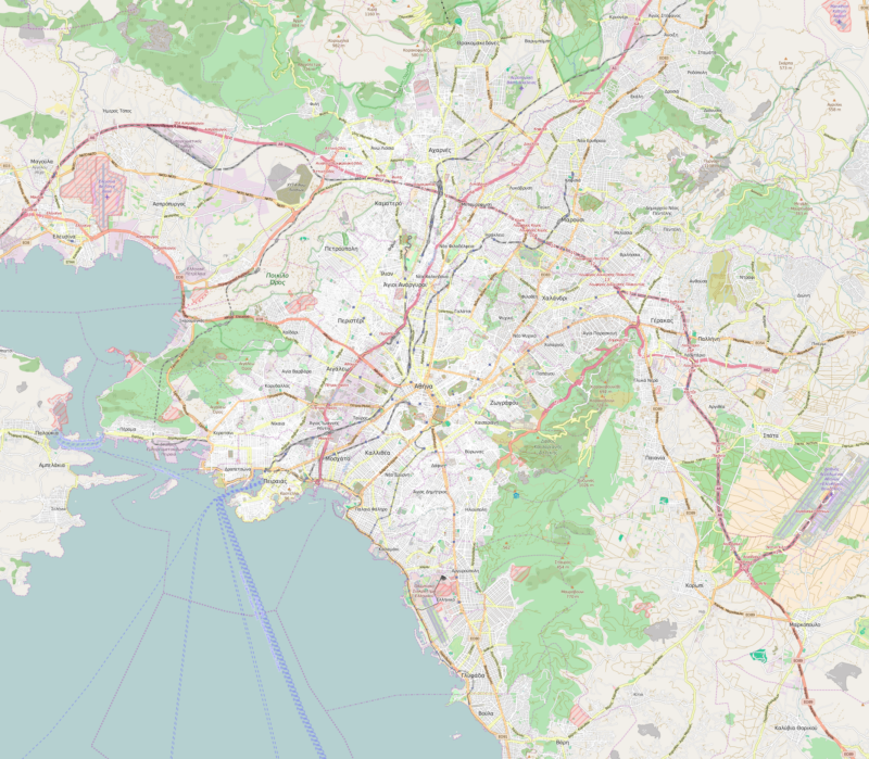 Person using laptop with Athens city digital map GIS platform urban planning data