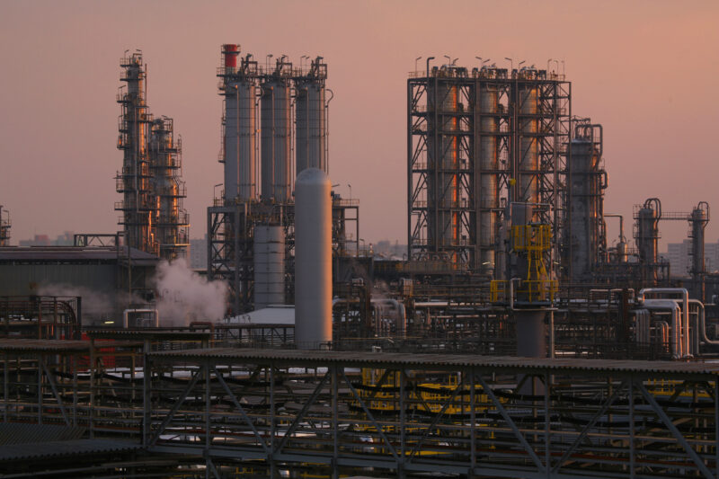 Oil tanker in Strait of Hormuz with military presence during Middle East tensions