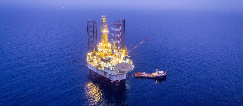 Oil refinery under attack with fire and smoke in Middle East conflict