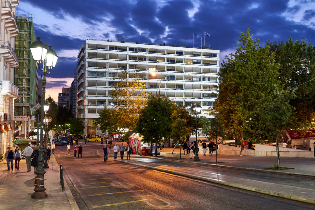 Greek government employee managing digital property registry system on computer